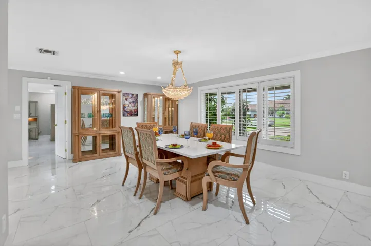 Sensational 48x24 porcelain tile floors adorned with 6' baseboards throughout.