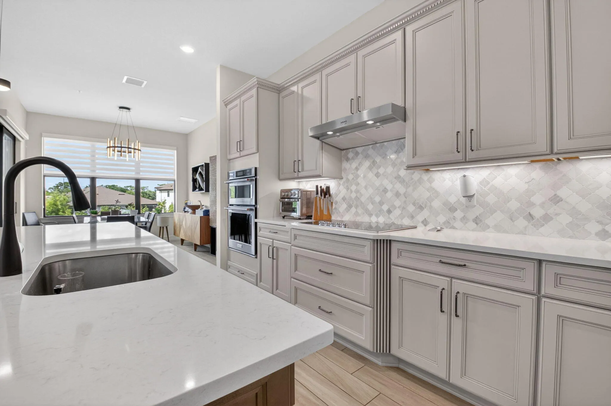 Oversized kitchen with walk-in pantry, 42" cabinets, KitchenAid appliances, quartz countertops, and much more!