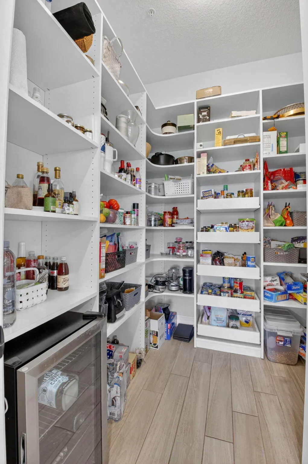 Oversized kitchen with walk-in pantry, 42" cabinets, KitchenAid appliances, quartz countertops, and much more!