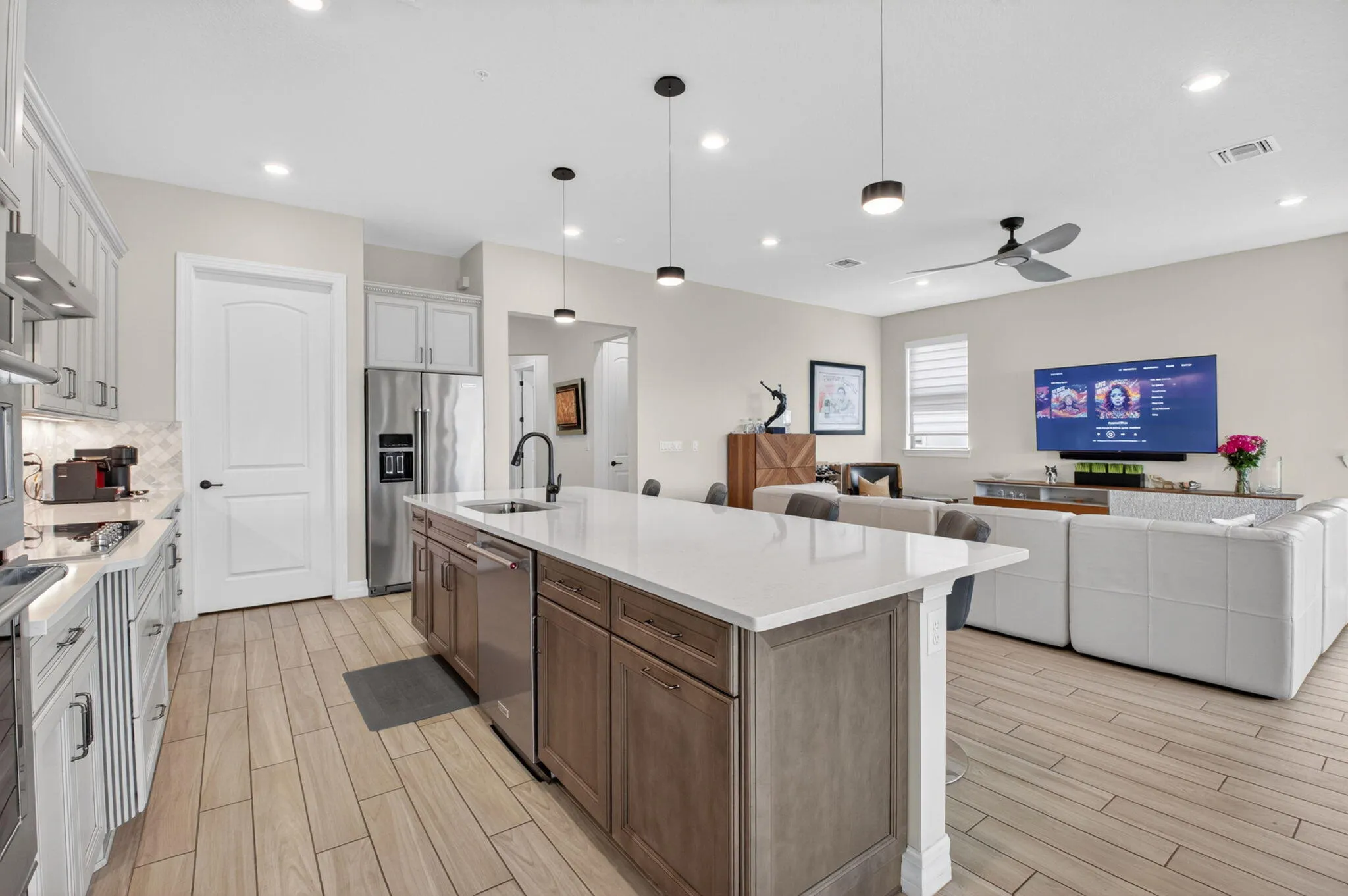 Oversized kitchen with walk-in pantry, 42" cabinets, KitchenAid appliances, quartz countertops, and much more!