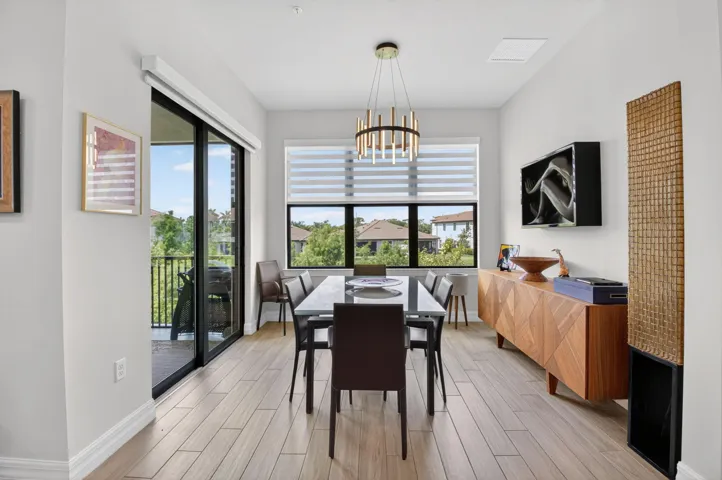 Dining Room with volume ceilings and lake views