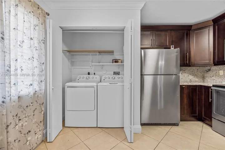 Kitchen with laundry, pantry, and plenty of storage space
