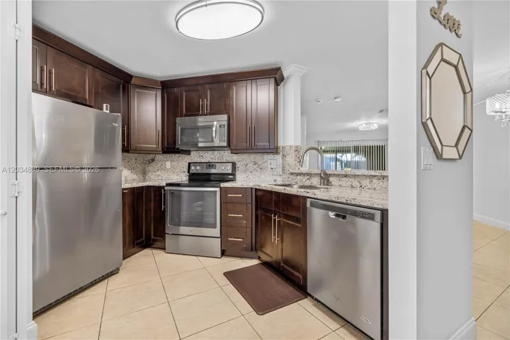 Spacious kitchen, stainless steel appliances, and a giant passthrough to the dining/living area