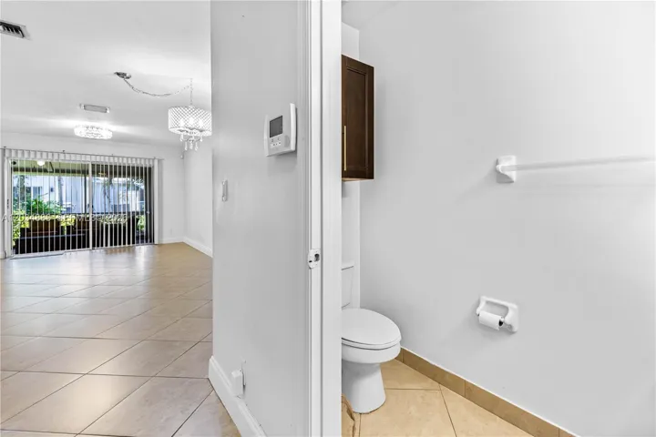 You're greeted with a half bath to the right when you enter the foyer and your kitchen to the left