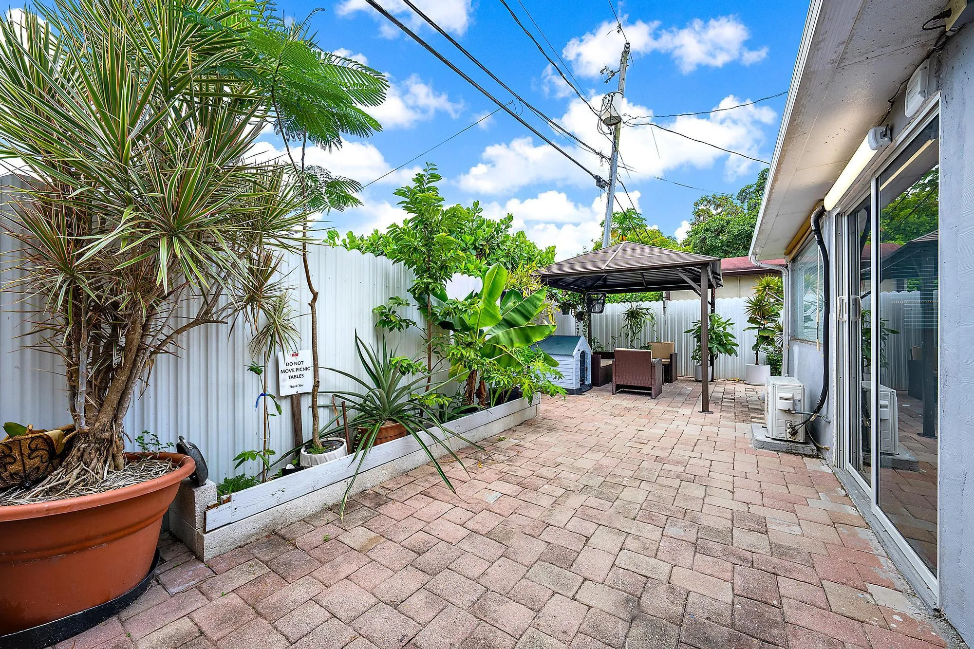 Leisure time at its finest. Fully paved patio with lots of mature plants - imagine morning coffee or celebrating with family