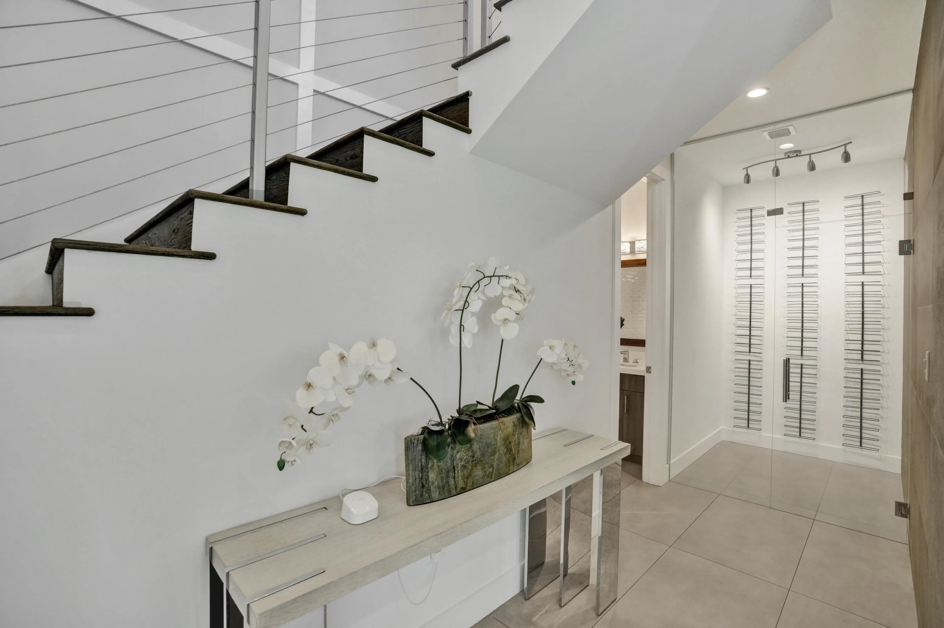 Entryway with wine storage.