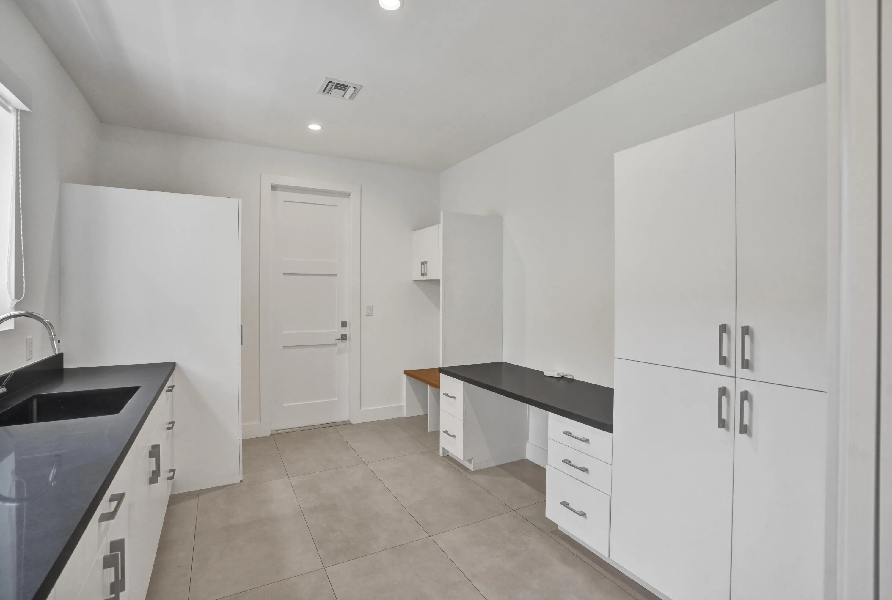 Downstairs laundry and butler pantry.