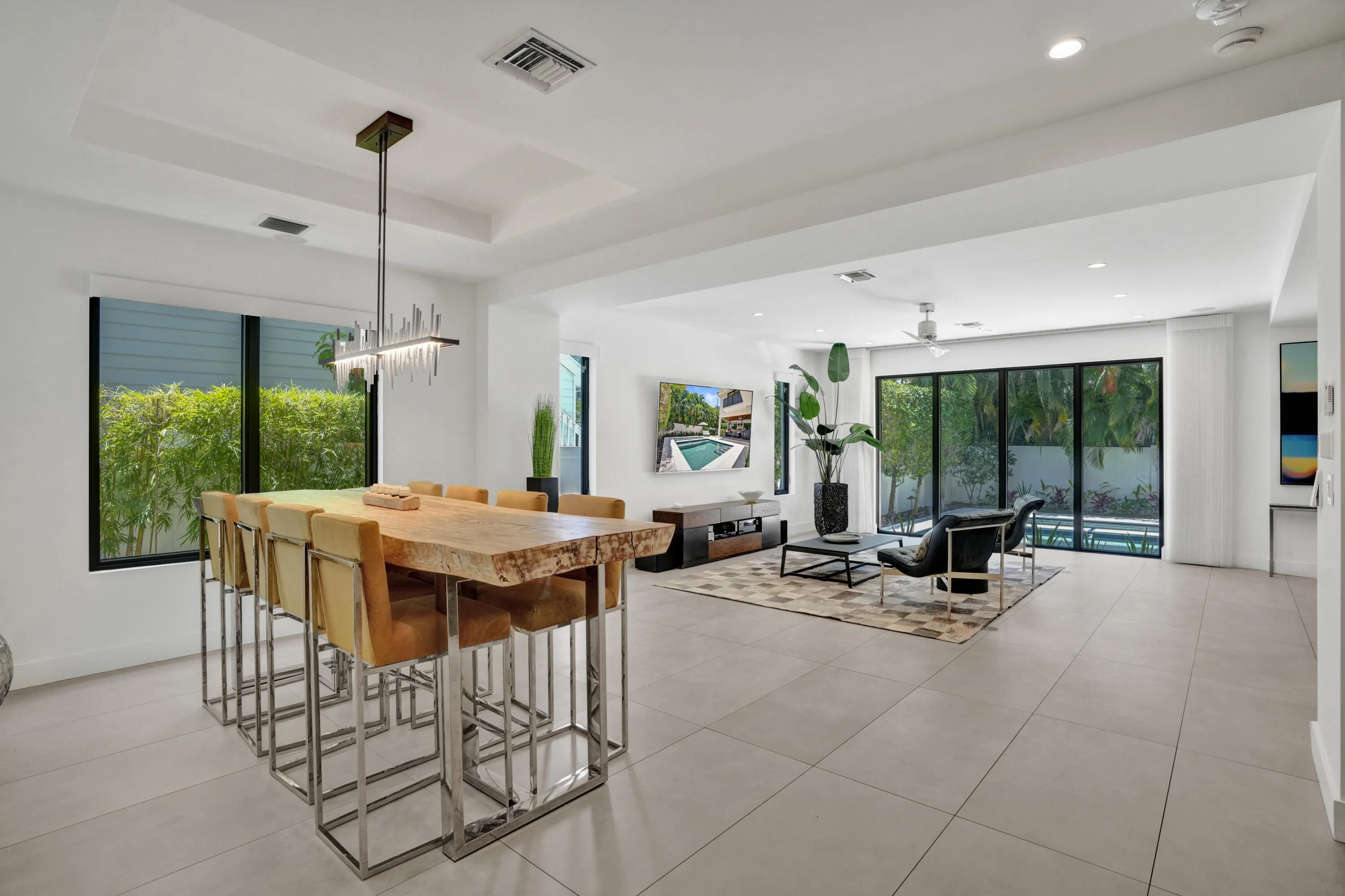 Dining area looking towards living area and pool views.