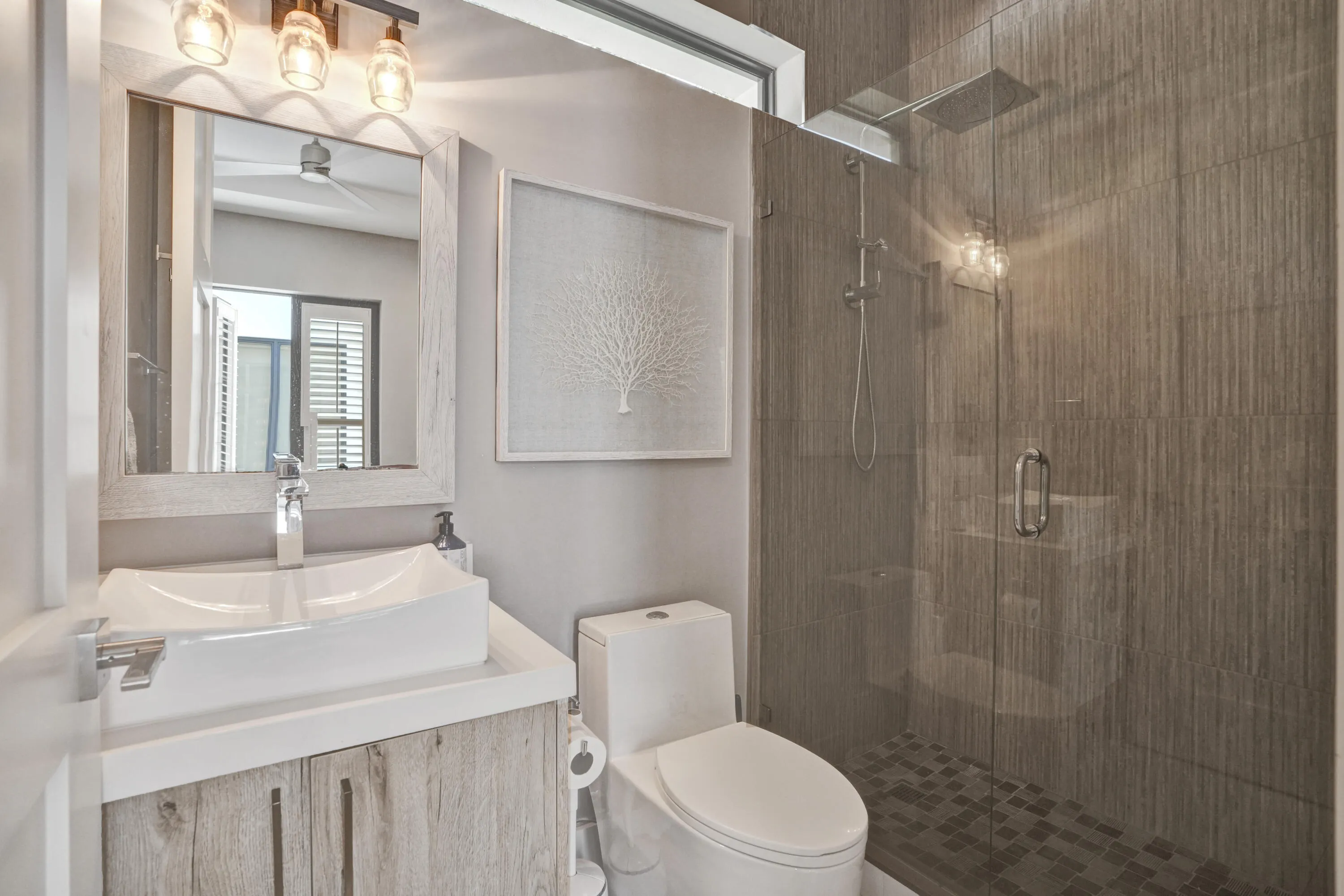 Full bath in guest suite with walk in shower.
