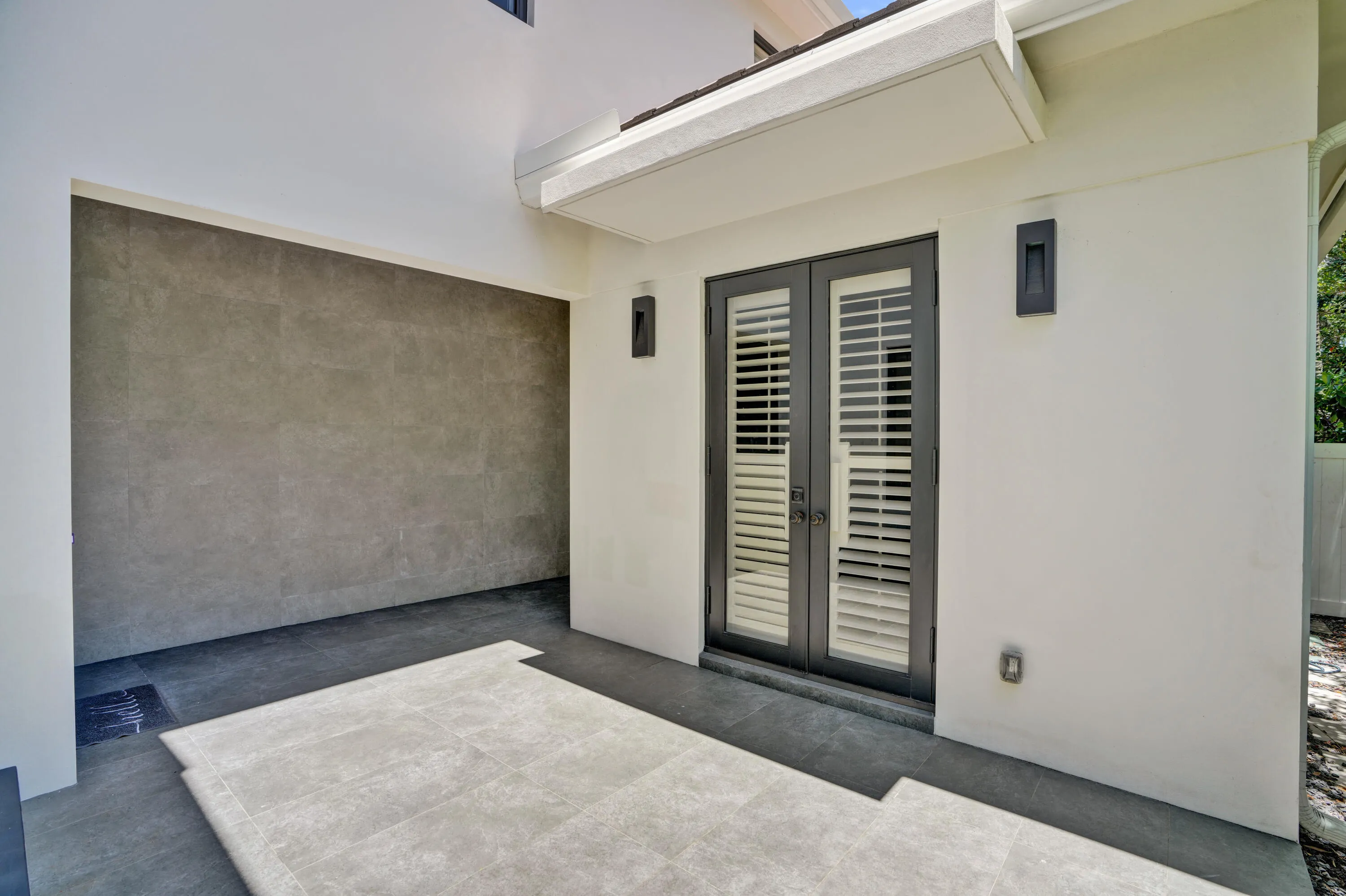 Double doors to private guest suite/office.