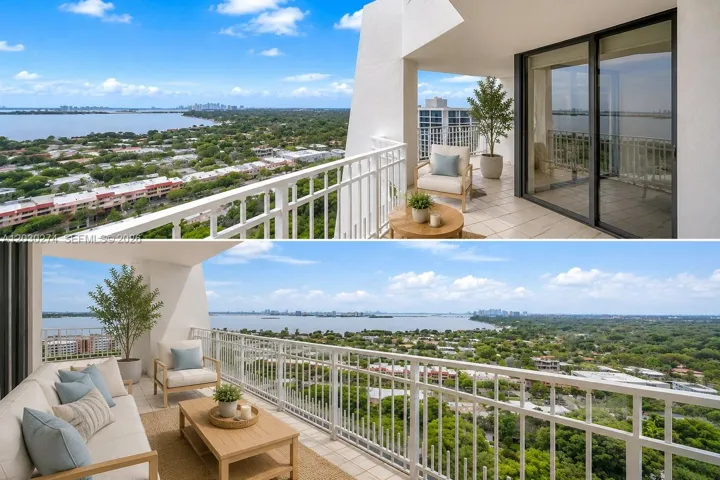 DIGITALLY STAGED TOWER SUITE BALCONY WITH THE MOST EXQUISTE VIEW OF WIDE INTRACOASTAL WATERWAY, LUSH GREEN LANDSCAPING AND CITY OF MIAMI IN THE BACKGROUND. THIS IS THE MOST OUTSTANDING VIEW IN MIAMI. MAKE THIS UNIT YOURS WITH THE VISION PROVIDED WITH SOFT LIGHT COLORS AND FURNITURE