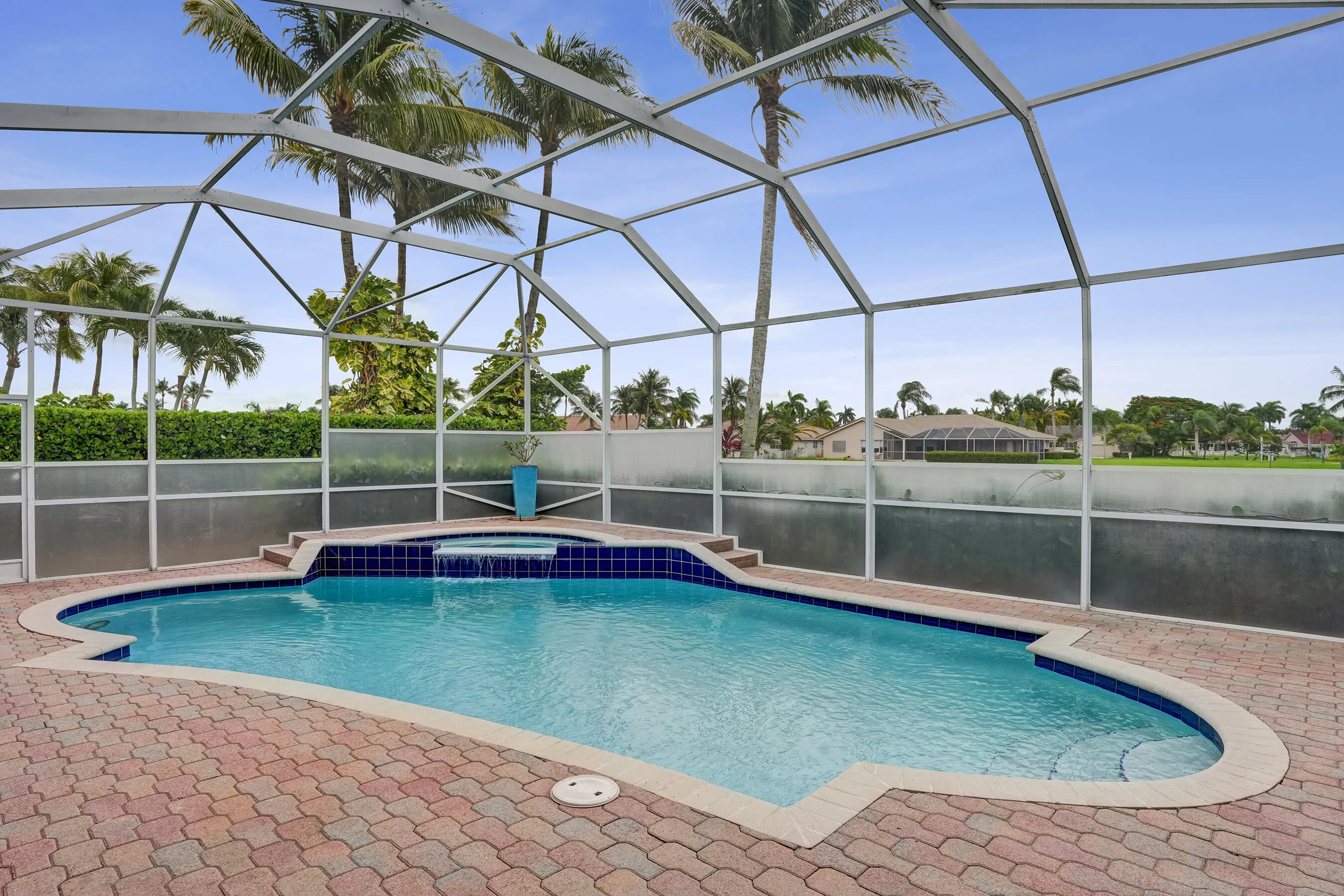 Screened pool/patio overlooking water