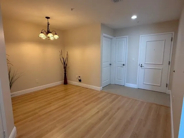 Foyer, Dining, door to 1/2 bath and entrance closet