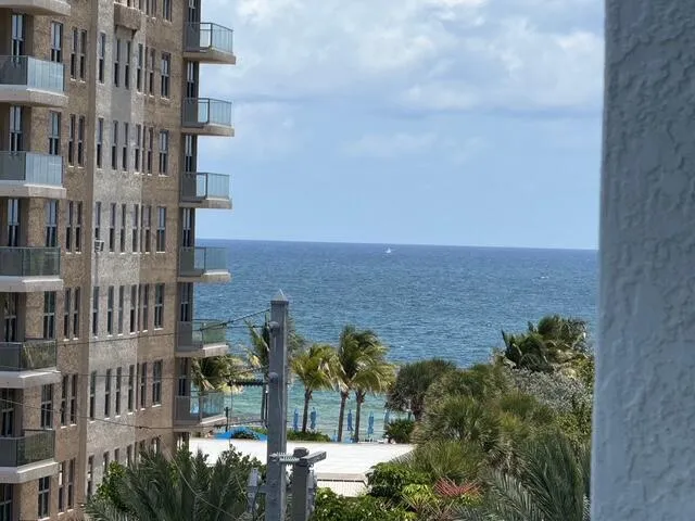 Expanded view of the ocean between buildings from the balcony
