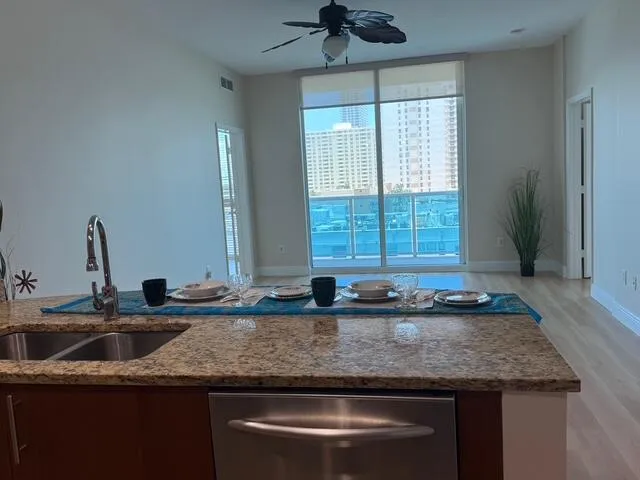 The kitchen offers pleasant outdoor views, making meal preparation and cleanup more enjoyable