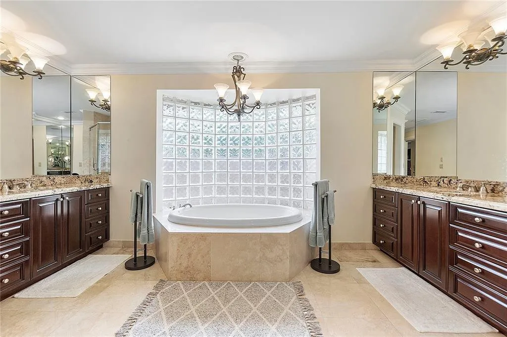 His and her sinks with Roman tub.