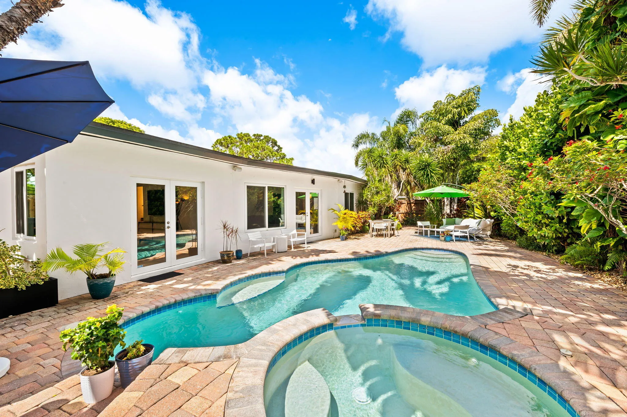 Backyard photo of heated saltwater pool and spa.