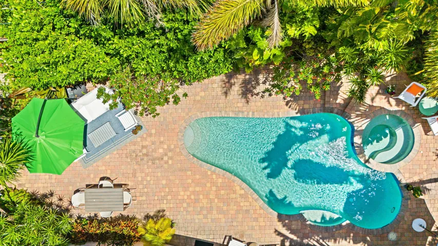 Pool, spa and paver patio aerial photo.