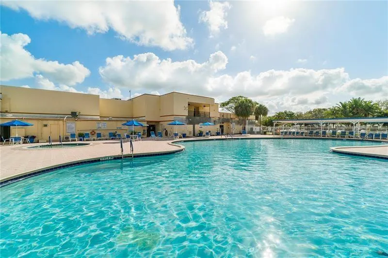 Main Pool with Jacuzzi and lounge chairs to enjoy!