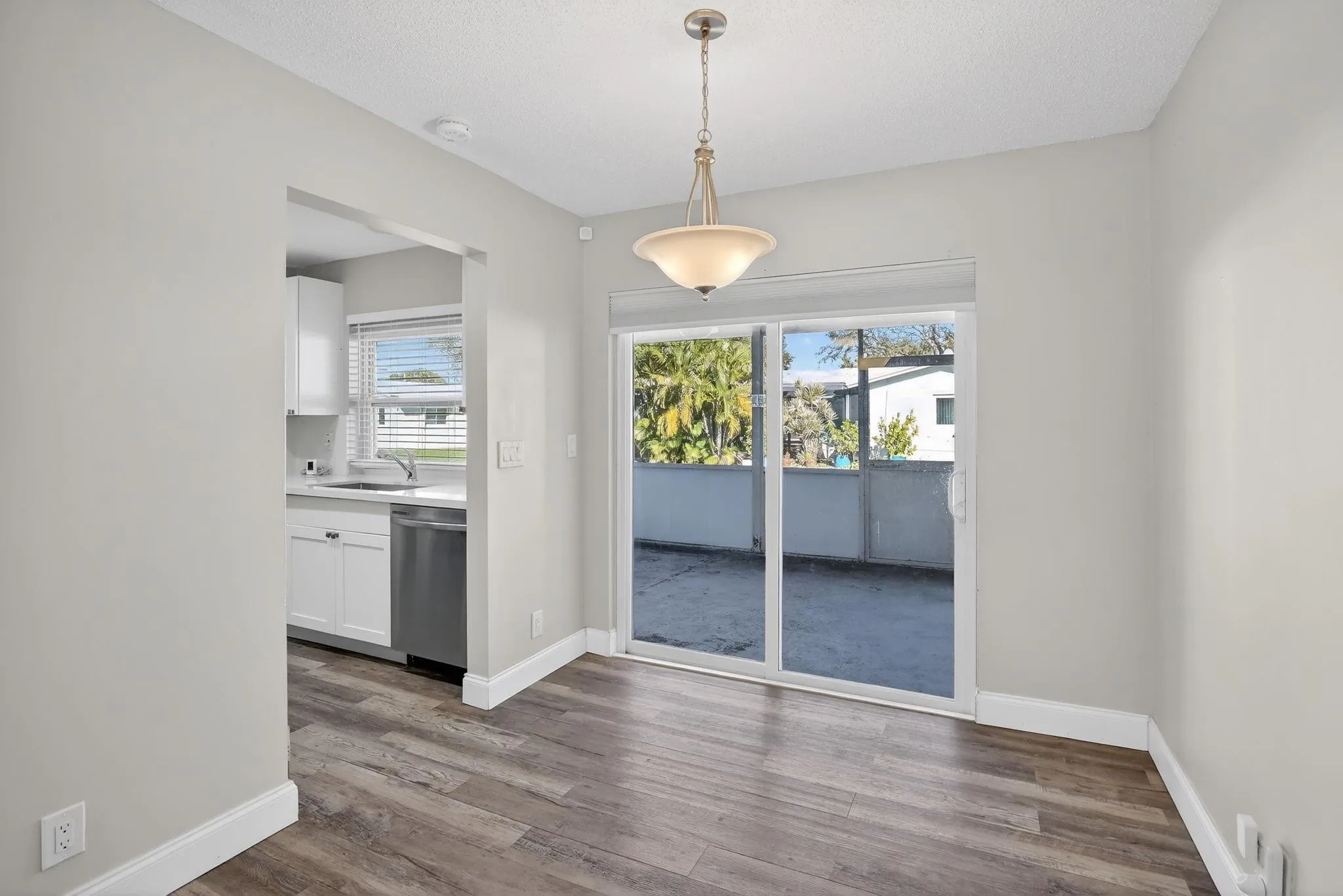 Dining room opens to back screened patio.