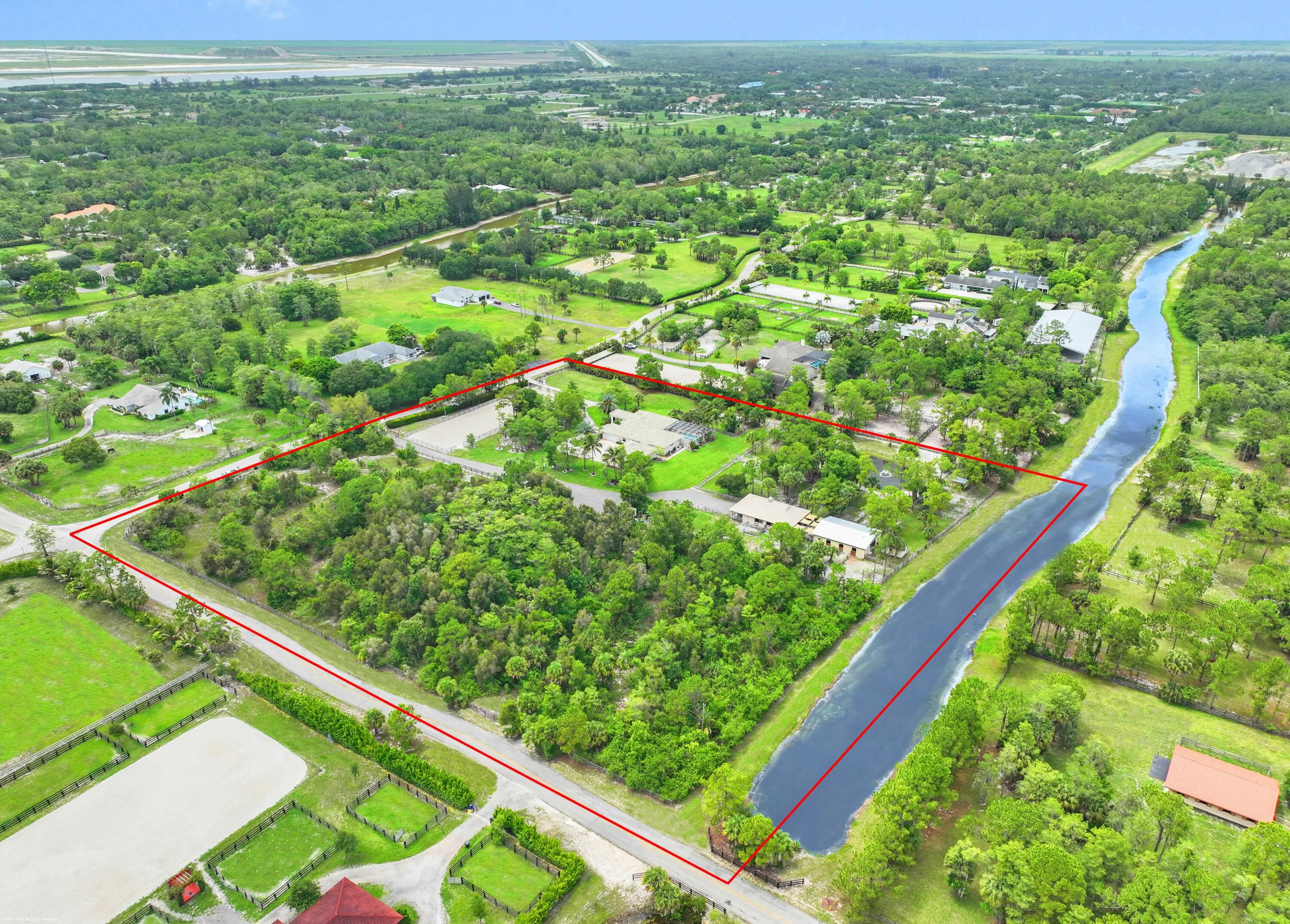 10-acre corner lot with direct bridle path access.