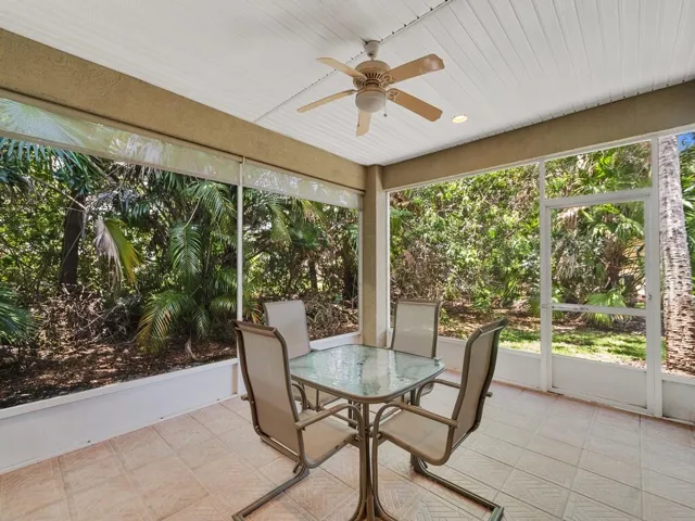 Screened patio featuring a ceiling fan, recessed lighting, and tile flooring