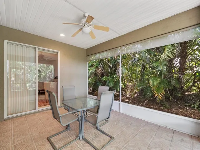 Screened patio featuring a ceiling fan, recessed lighting, and tile flooring