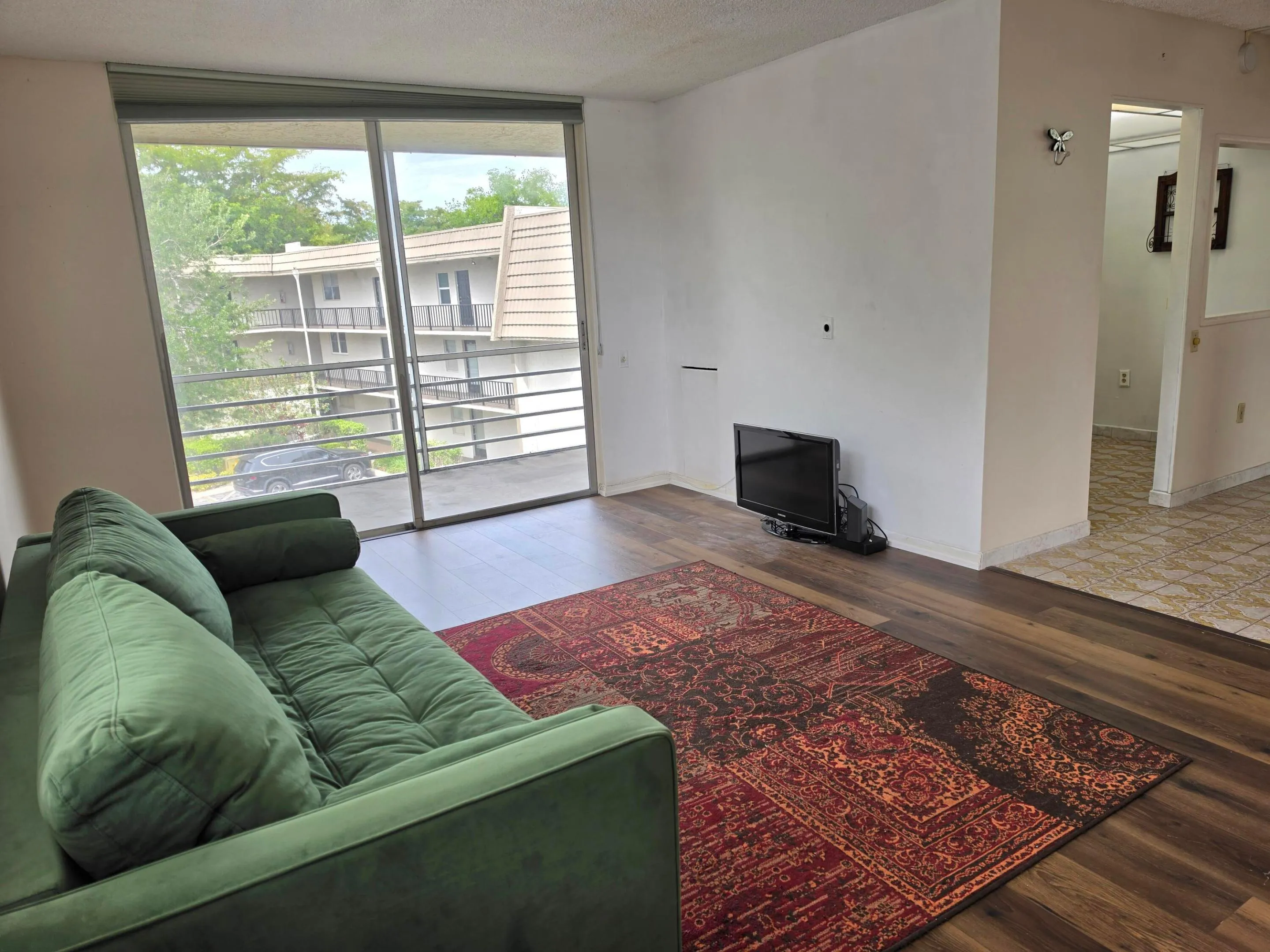 Living Room with Sliding Glass Door to Balcony