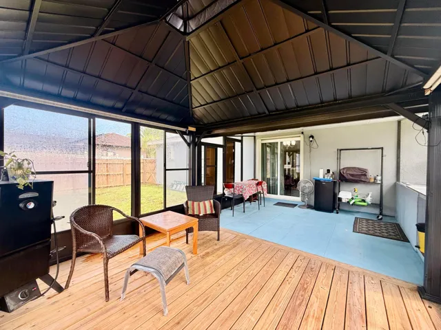 patio-has pull down sun shade, decked,screeened,covered