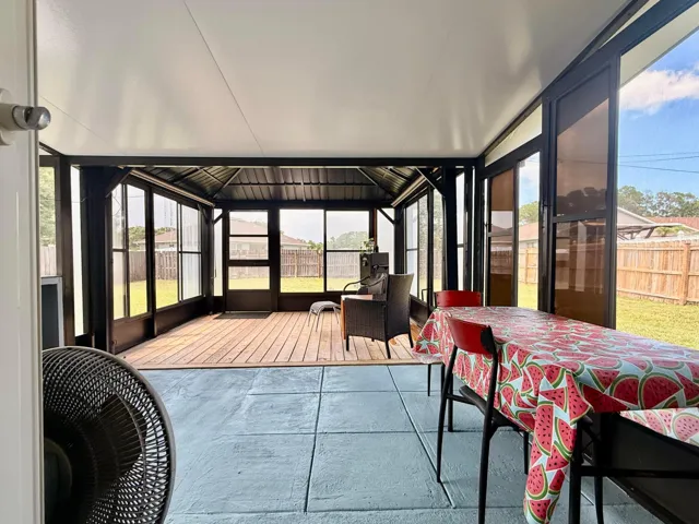 deck/extended covered and screened patio with summer/dirty kitchen