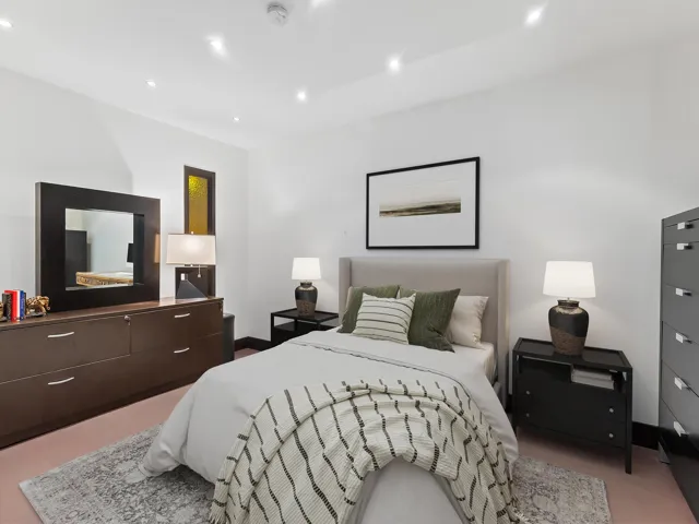 DISCLAIMER: Digitally enchanted photo with a bed and night stands and all other information depicted are illustrative, and are provided to assist in visualizing the home and may not be accurately depicted.