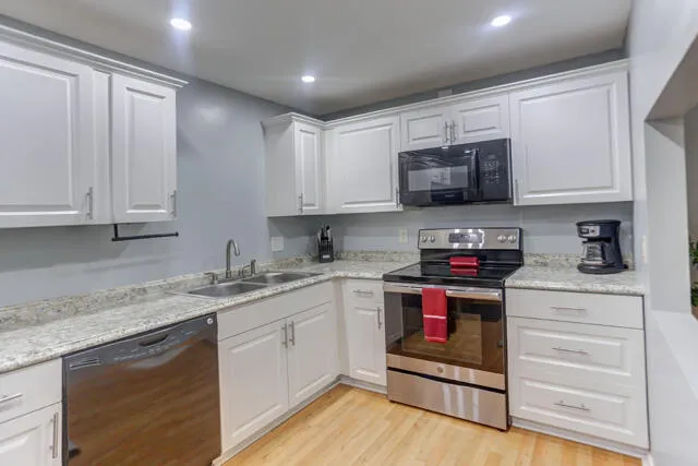Kitchen with stainless appliances. 1010 Green Pine Blvd E1 West Palm Beach,FL