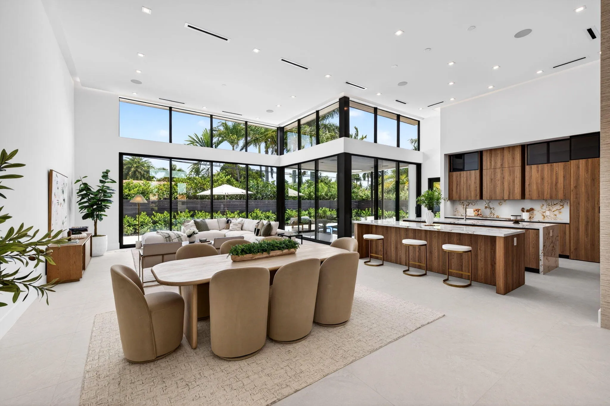 The kitchen combines sculptural design and daily function with premium appliances, custom storage, and polished modern finishes.