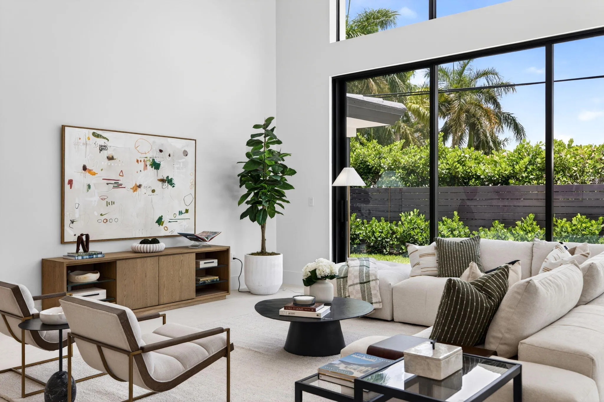 Light-filled interiors emphasize dramatic volume, clean modern finishes, and a seamless connection between living and entertaining spaces.