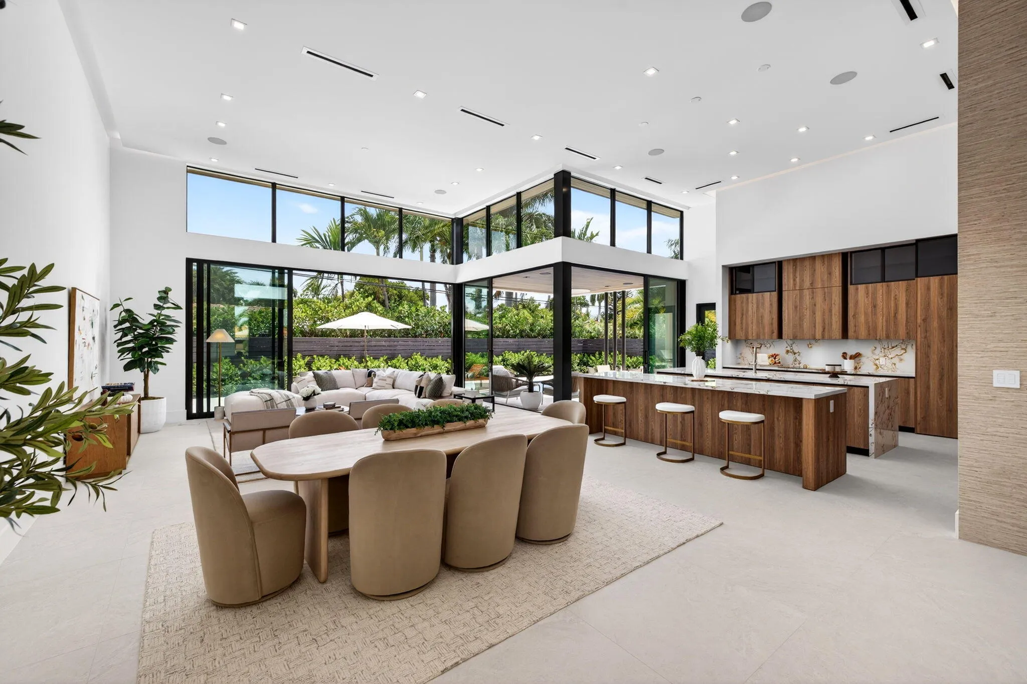 The primary suite offers a serene retreat with garden views, soft natural light, and a calm luxury sensibility.