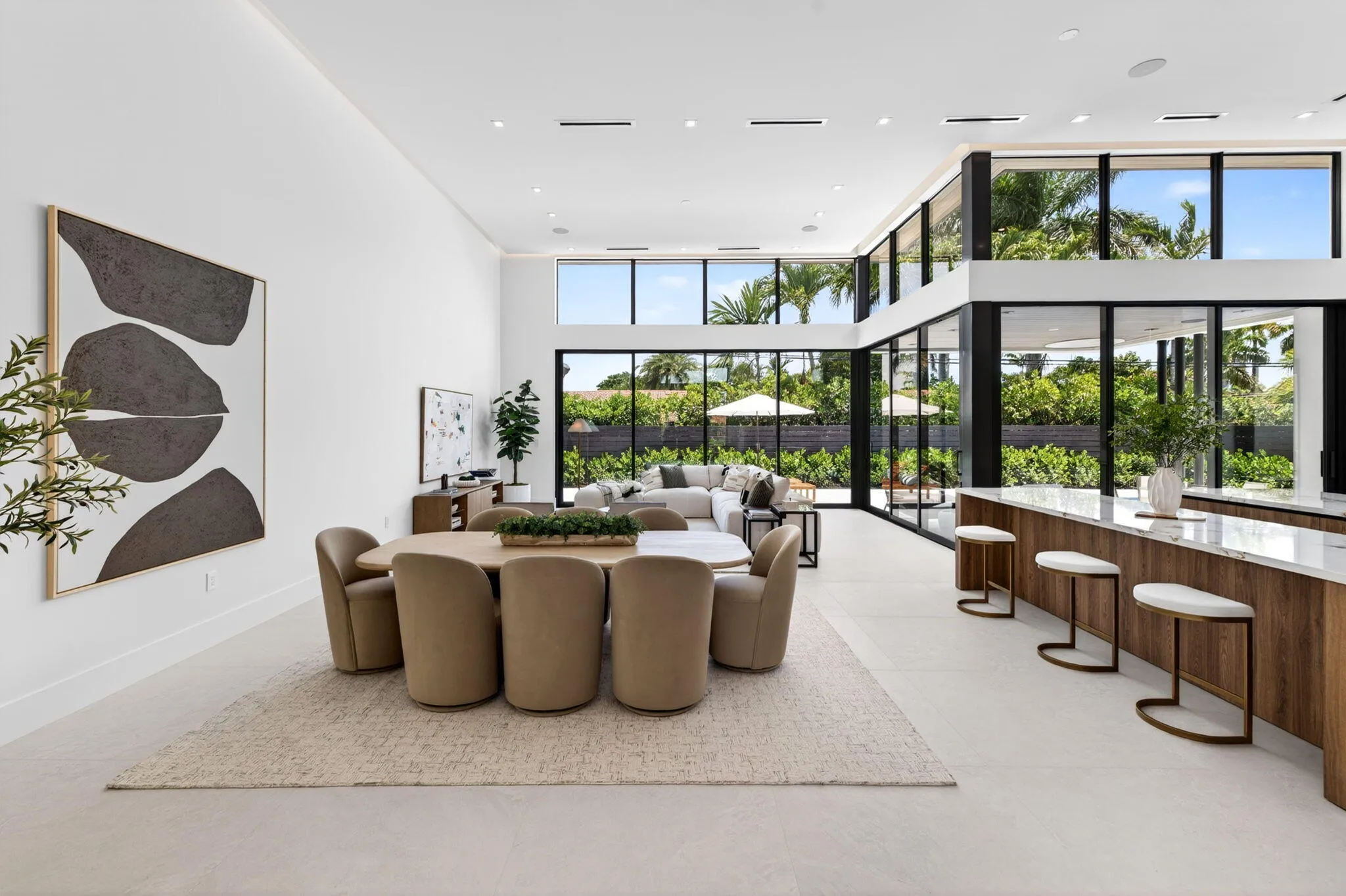 An open interior perspective captures the home's airy scale, refined material palette, and effortless single-story living.