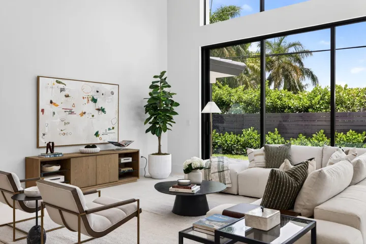 Light-filled interiors emphasize dramatic volume, clean modern finishes, and a seamless connection between living and entertaining spaces.