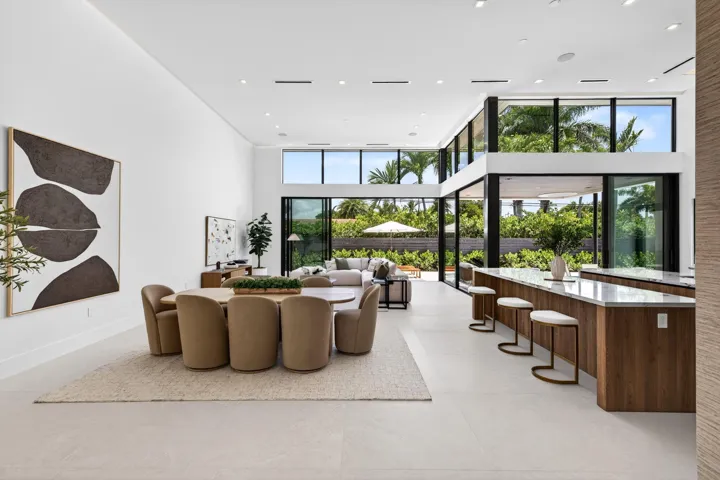 An open interior perspective captures the home's airy scale, refined material palette, and effortless single-story living.