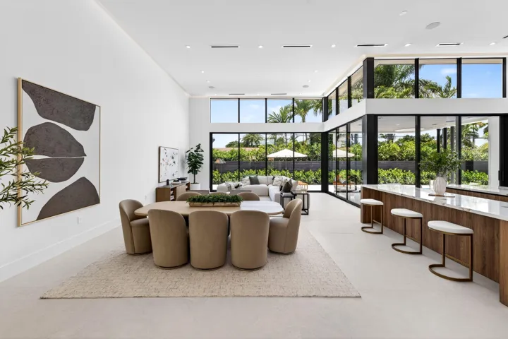 An open interior perspective captures the home's airy scale, refined material palette, and effortless single-story living.