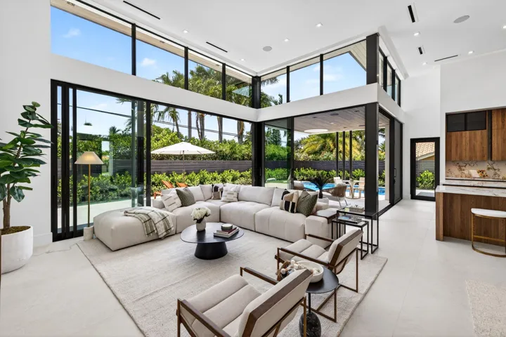 Light-filled interiors emphasize dramatic volume, clean modern finishes, and a seamless connection between living and entertaining spaces.