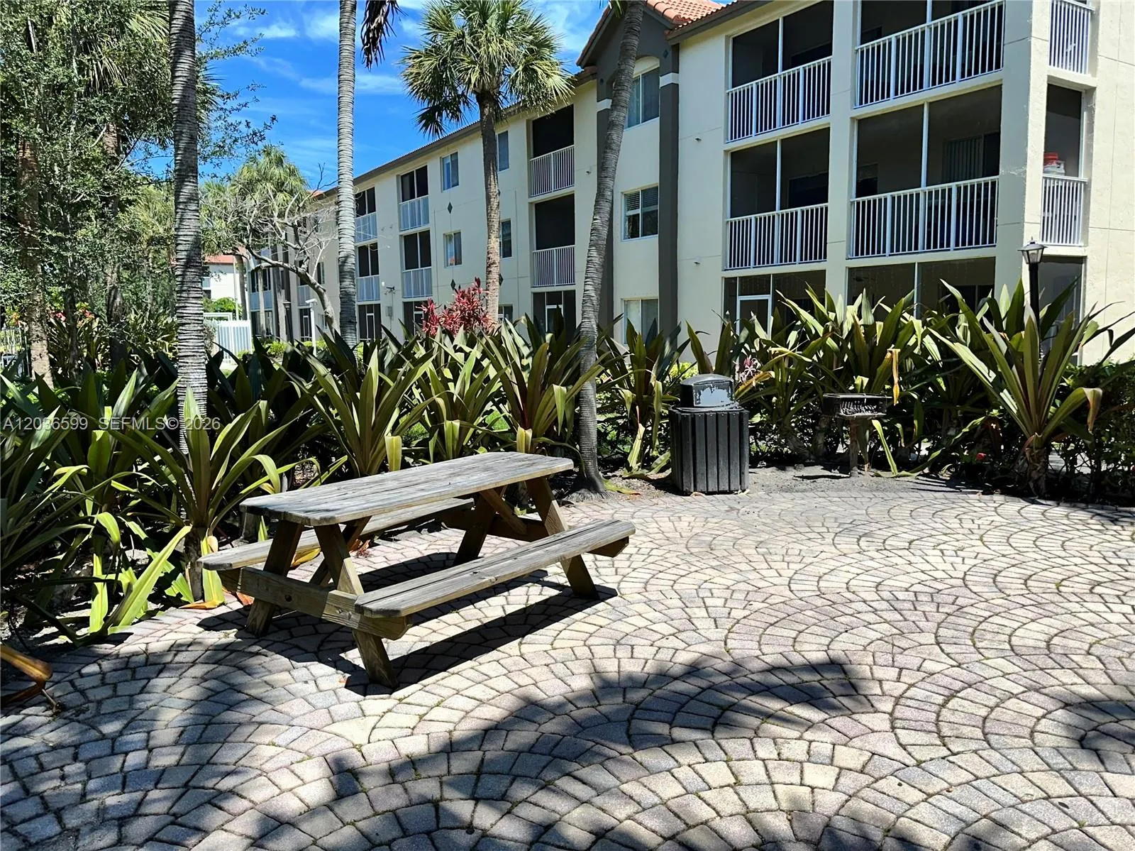 COMMUNITY PICNIC TABLE AND GRILL AREA