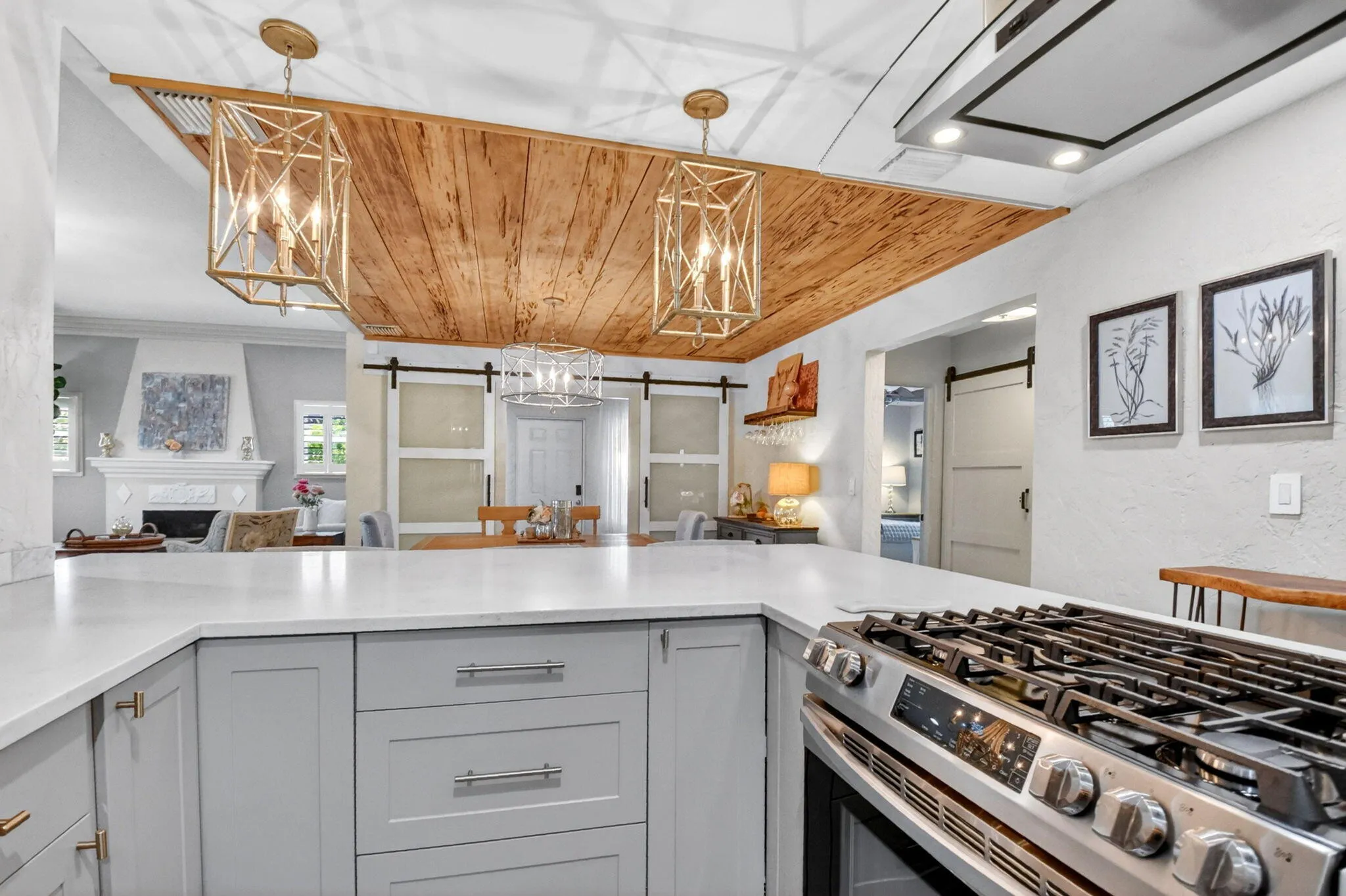 Beautifully updated kitchen quartz counters, shaker cabinets, gas stove and modern appliances.