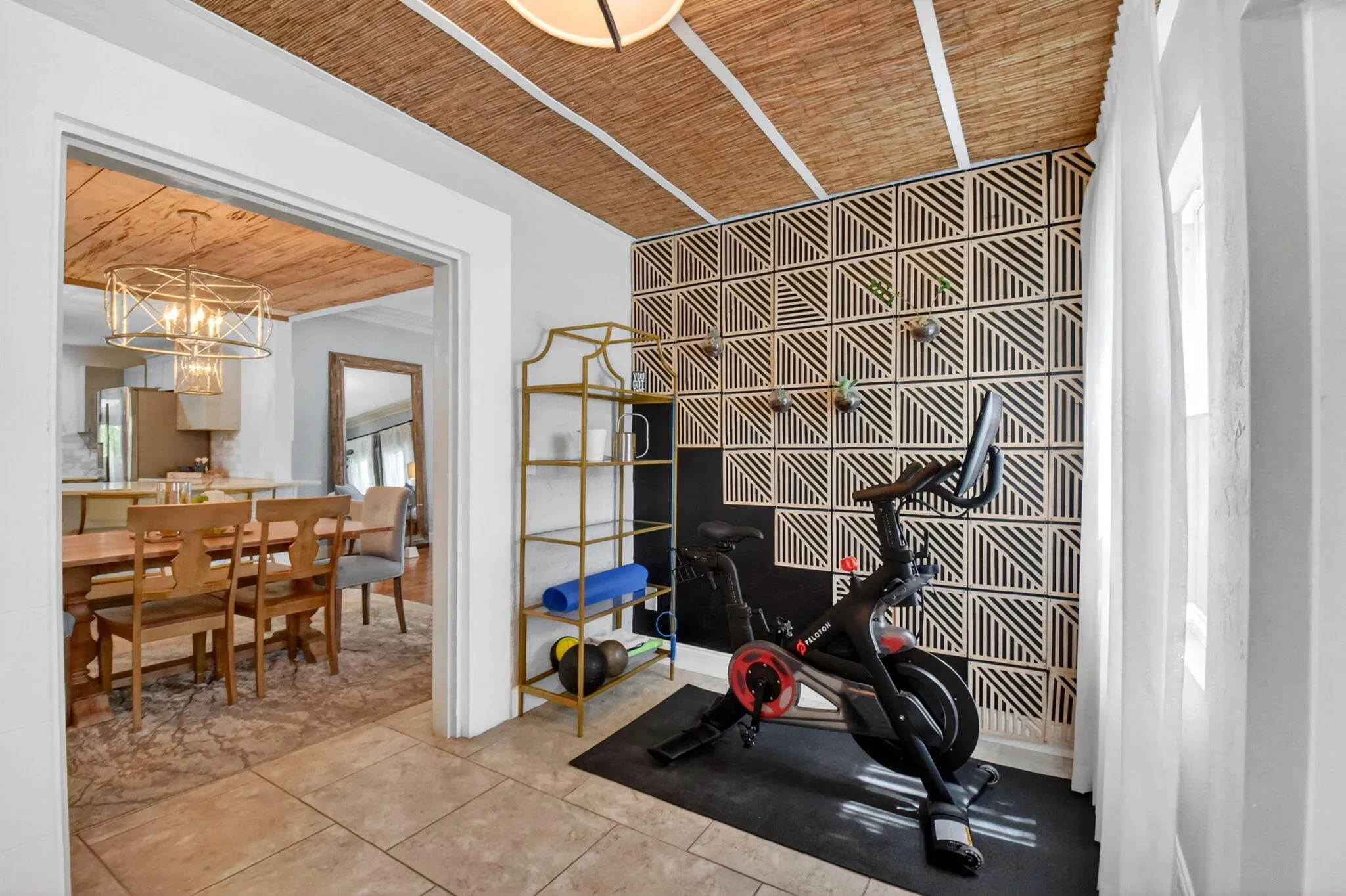 Side entrance with spare room, currently used as a fitness studio.
