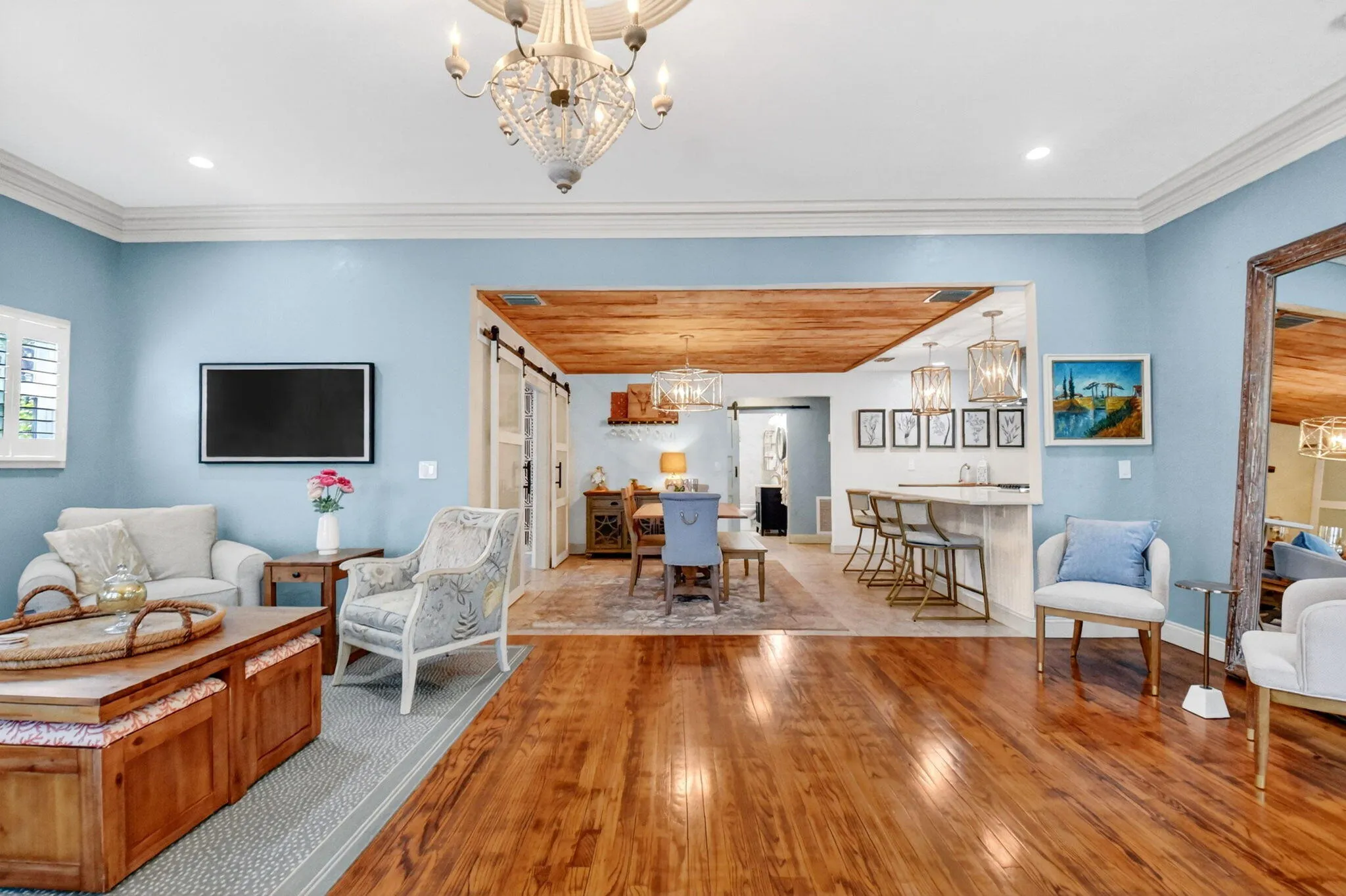 Adjoining dining area with pecky cypress ceilings.