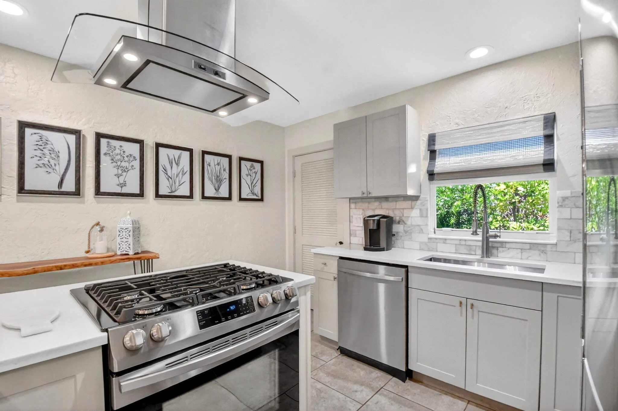 Natural light streams in the kitchen and adjoining pantry.