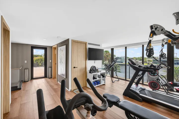 A private fitness destination positioned to enjoy elevated river views, bringing wellness and luxury together within the home.