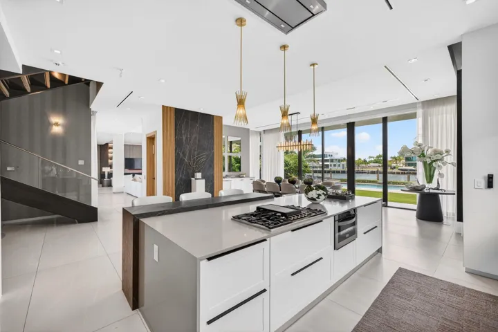 An elegant culinary environment designed for both daily living and grand entertaining, with custom cabinetry, refined surfaces, and effortless flow to the main living spaces.
