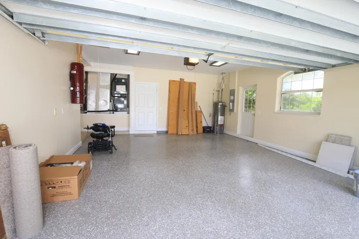 INCLUDES PULL DOWN ATTIC STAIRS & PEDESTRIAN DOOR TO SIDE YARD.