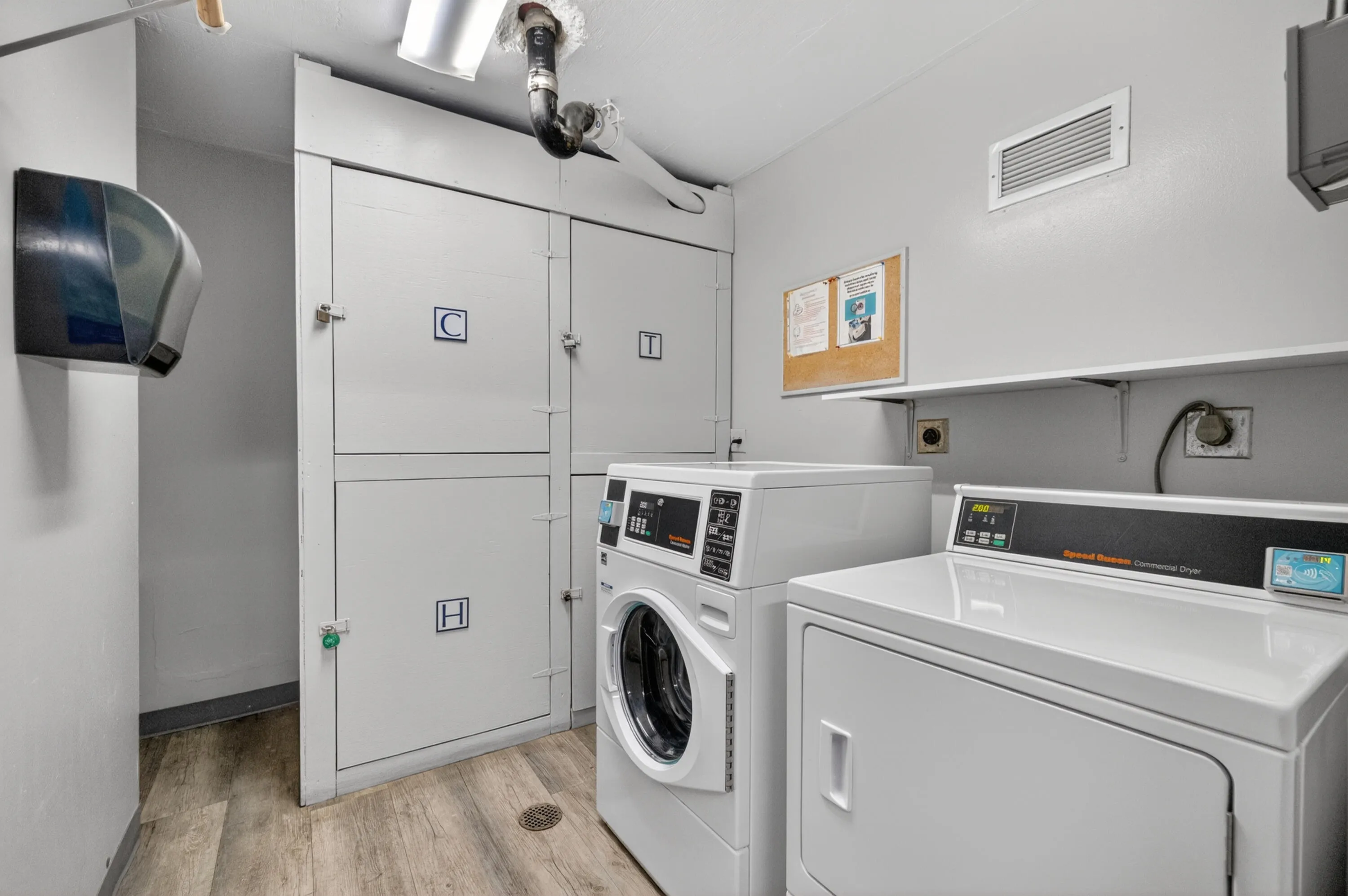 Washer, dryer and storage area down the hall
