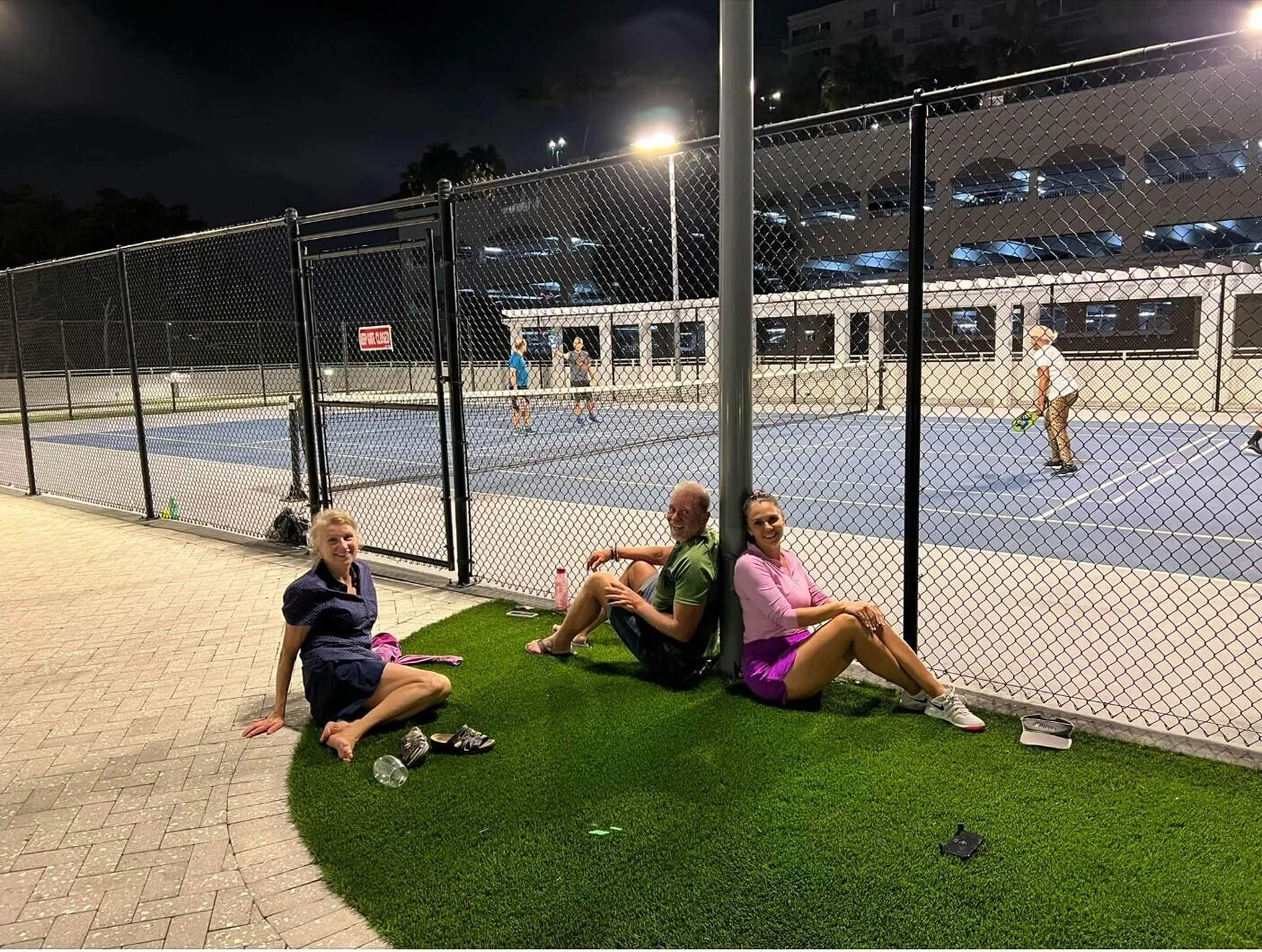 Pickle ball players resting